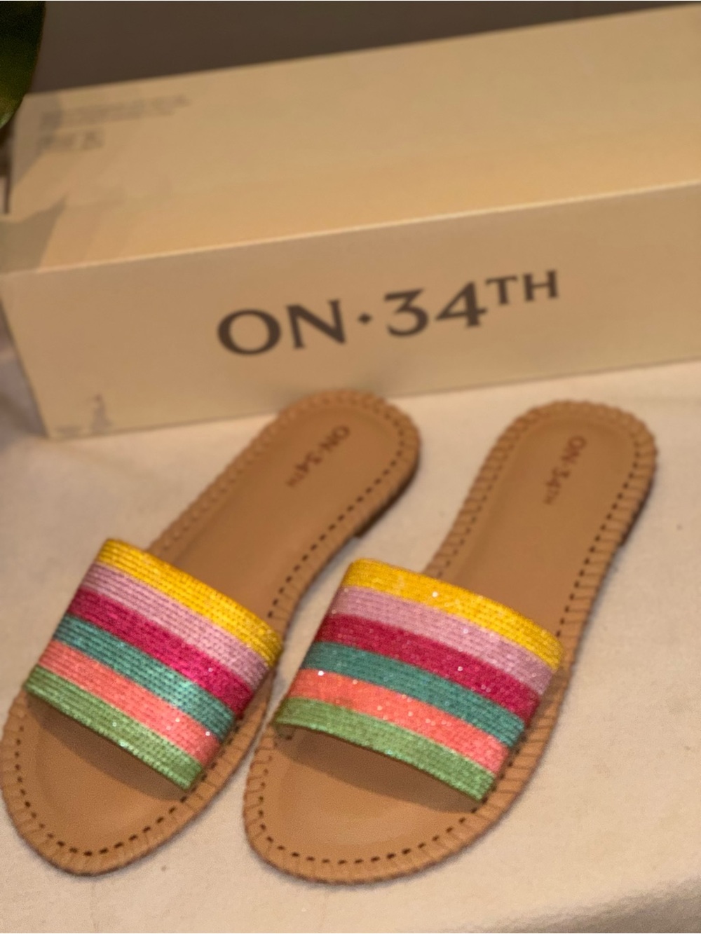 On 34th Women's Mavise Beaded Flat Slide Sandals featuring a rainbow-striped